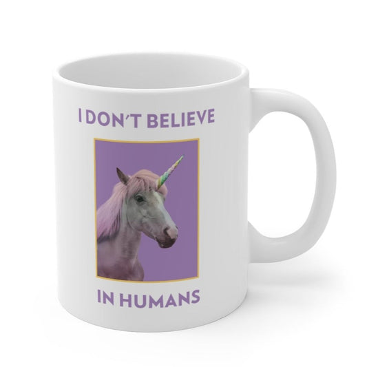 Skeptic Mug: Humans Are Not Real: white, purple unicorn, cartoon novelty style