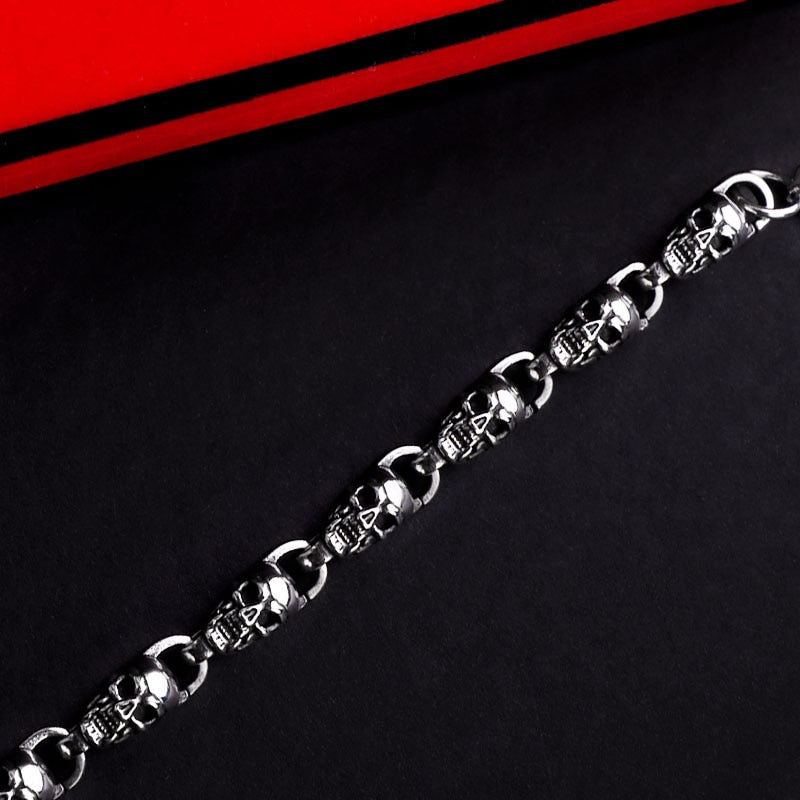 Reworking the title to emphasize the product's essence while maintaining its distinctiveness from the original. Any references to '""' or similar labels should be eliminated. 

Skull-Adorned Gothic Chain Bracelet