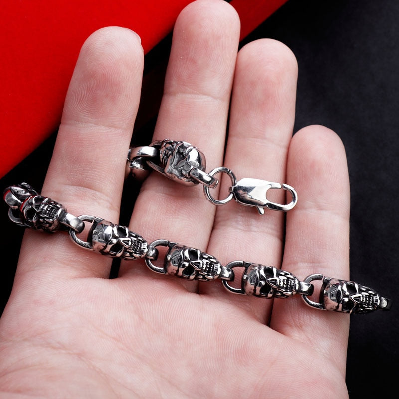 Reworking the title to emphasize the product's essence while maintaining its distinctiveness from the original. Any references to '""' or similar labels should be eliminated. 

Skull-Adorned Gothic Chain Bracelet