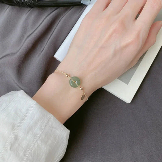 Fashion Bracelet with Charming Jade Design: gold, muted green bracelet, minimal style