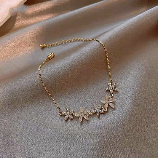 Petal Blossom Wristlet: gold, clear floral, delicate, feminine, floral style