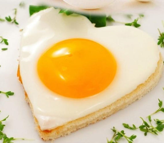 Stainless Steel Pancake Shaping Mold Set - 4 Pieces: white, yellow-orange fried egg on toast, food photography style