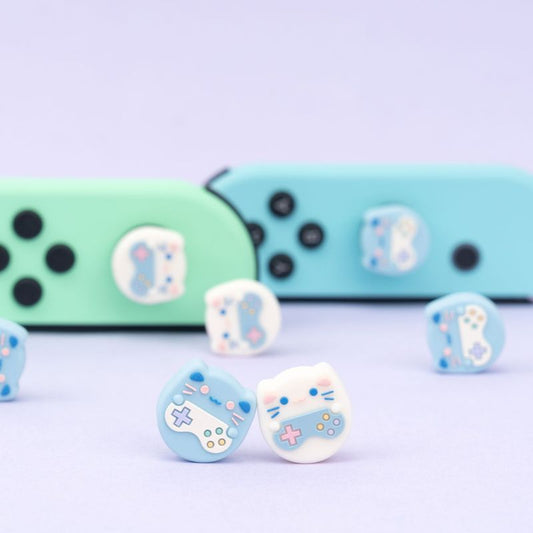 Cat Switch Thumb Grips with Joystick Caps: light blue, white cat and game-controller-themed designs, kawaii cartoon style