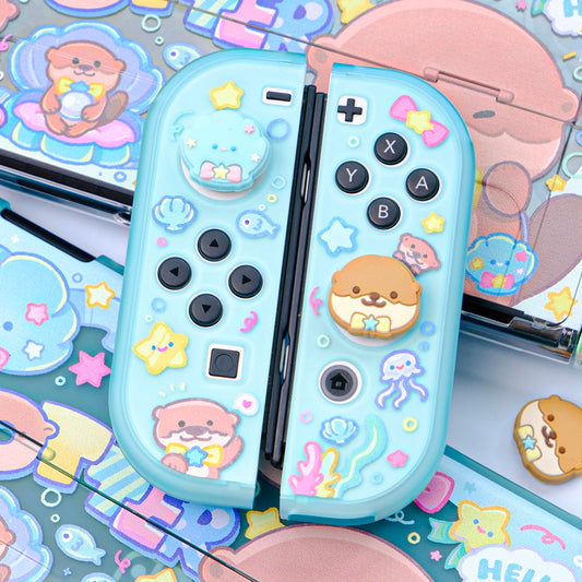 Cute Otter Switch Thumb Grips, Compatible: light blue, pink cute animal characters and sea-themed icons, kawaii cartoon style