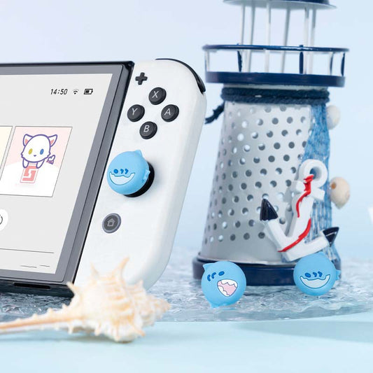 Sea Creature Switch Thumb Grips with Joystick Caps: light blue, white cartoon shark faces, cartoon, kawaii style