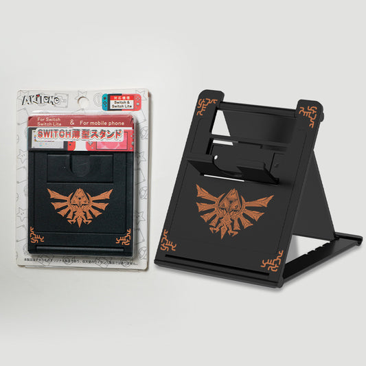 Tears of the Kingdom Phone Stand: black, orange-brown The Legend of Zelda-style crest/emblem, video game themed, graphic styl